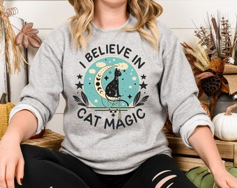 I Believe In Cat Magic Black Cat Sitting on A Moon, Magical Retro Colour Art, Moon Phases Unisex Heavy Blend™ Cat Lovers Crewneck Sweatshirt