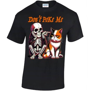 May include: Black t-shirt with a skeleton and a cat. The skeleton is pointing at the cat and the text "Don't Poke Me" is above them.