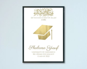 May include: A white framed print with a gold graduation cap and the text "My success is only by Allah [11:88]" and "Shabana Yusuf University of Greenwich BSC (Hons) Psychology Class of 2022".