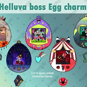 May include: Five colorful egg-shaped charms featuring characters from the animated series "Helluva Boss". Each charm has a different character and background. The charms are 2.5 inches in diameter and are made of epoxy-coated metal.