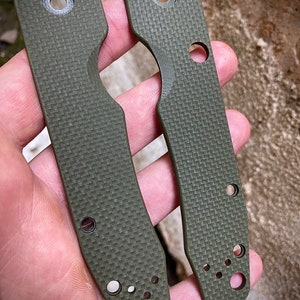 May include: Two green, textured, knife scales with multiple holes. The scales are made of G10 material and are designed for a custom knife.