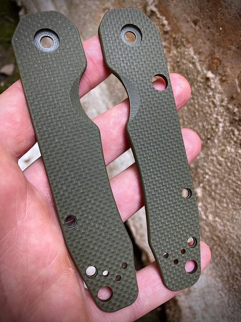 May include: Two green, textured, knife scales with multiple holes. The scales are made of G10 material and are designed for a custom knife.