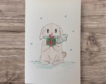 Watercolor card of a rabbit in the snow / greeting card. Original watercolor with envelope, unique design.