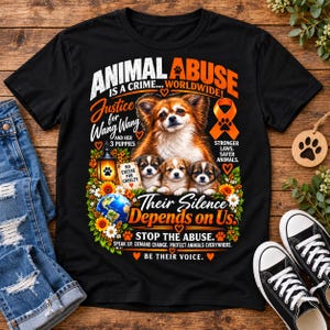 May include: A black t-shirt featuring a graphic of a dog and three puppies. Text reads: ANIMAL ABUSE IS A CRIME... WORLDWIDE! Justice for Wang Wang and her 3 puppies, No excuse for cruelty, Stronger laws, Safer animals, Their Silence Depends on Us, STOP THE ABUSE, SPEAK UP. DEMAND CHANGE. PROTECT ANIMALS EVERYWHERE. BE THEIR VOICE.