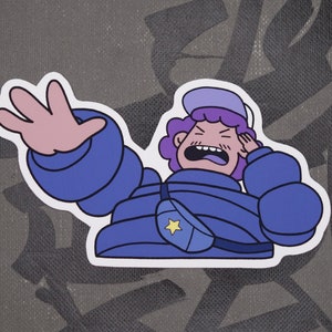 May include: A blue and purple cartoon character with a star on their jacket, wearing a blue puffy jacket and a white hat, is yelling with their hand over their ear.