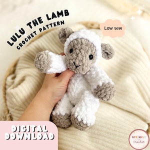 May include: A crochet lamb toy, white and grey, with the text "Lulu the Lamb Crochet Pattern" and "Digital Download". The image also includes the text "Low sew". The lamb has a fluffy texture and is handmade.