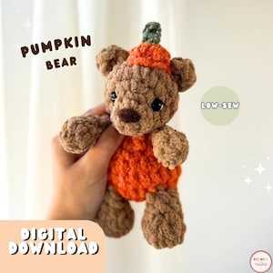 May include: A brown crocheted bear plush toy wearing an orange pumpkin-shaped body and hat with a green stem. The image includes the text PUMPKIN BEAR, LOW-SEW, and DIGITAL DOWNLOAD. The bear has dark eyes and a dark brown nose.