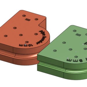 May include: Two pipe benders, one orange and one green, are shown. The orange bender is labeled "10 mm" and the green bender is labeled "8 mm". Both have a curved channel and several holes.