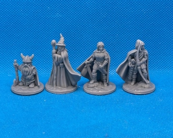 May include: Four miniature fantasy figures, painted in gray, standing on circular bases. The figures include a wizard with a staff, a warrior with a sword, a dwarf with an axe, and a ranger with a bow and arrow.
