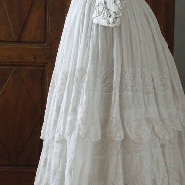 Wonderful 1840's  antique ruffle layered muslin skirt with white on white embroidery.