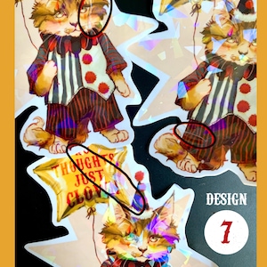 K&ouml;nnte beinhalten: Ein Set mit drei holografischen Aufklebern, die eine Comic-Katze zeigen, die als Clown verkleidet ist und einen Ballon h&auml;lt. Die Ballons haben den Text "I'm Just Clowning" und "My Thoughts Just Clowning". Die Aufkleber sind mit "B Grades (Holo)" und "Design 7" gekennzeichnet.