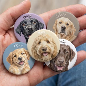 May include: Five circular dog portrait badges, each displaying a different breed and name: Oliver, Charlie, Max, Willow, and Bailey. The badges are held in a hand, highlighting the detailed illustrations and varied colour schemes.
