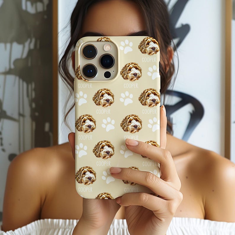 Custom pet phone case with a personalized dog illustration, name 'Cooper,' and paw print design. Fits various models, including iPhone 16. A unique gift for dog lovers or a thoughtful pet memorial.
