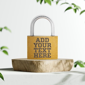 May include: A gold padlock with a silver shackle. The padlock has the text "ADD YOUR TEXT HERE" printed on it.