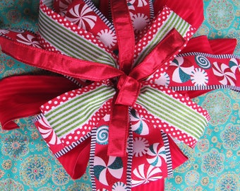 Red and green whimsical peppermint bow, great for gifts, lanterns, wreaths and tree topper