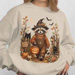 ジモシー・ラクーン・ウィッチ・ハロウィン・イラスト・クルーネックスウェットシャツ | パンプキン・オータム