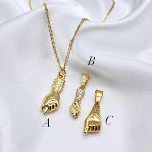 Gold fist pendant store