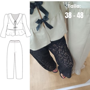 Puede incluir: Un conjunto de dos piezas con una blusa color crema con lazos negros y pantalones de encaje negro. La imagen también incluye un dibujo lineal del conjunto y el texto "Talla: 38 - 48".