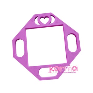 May include: A pink plastic frame with a heart cut out in the center. The frame has four oval-shaped cutouts on the sides. The frame is designed for crafts and is made of 3D printed plastic.