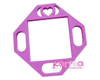 May include: A pink plastic frame with a heart cut out in the center. The frame has four oval-shaped cutouts on the sides. The frame is designed for crafts and is made of 3D printed plastic.