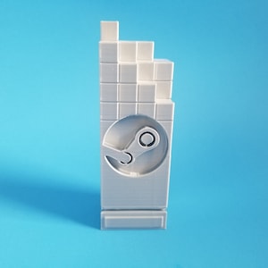 May include: A white 3D printed trophy with a pixelated design and the Steam logo. The trophy is on a blue background.