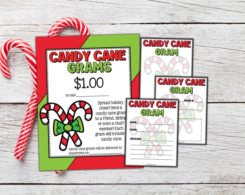 Peut inclure: Une affiche imprimable rouge et verte avec le texte "Candy Cane Grams 1,00 &euro;" et une image de dessin anim&eacute; de deux cannes en sucre li&eacute;es par un n&oelig;ud vert. L'affiche comprend &eacute;galement des instructions pour envoyer un gramme de canne en sucre &agrave; un ami, un fr&egrave;re ou un membre du personnel.
