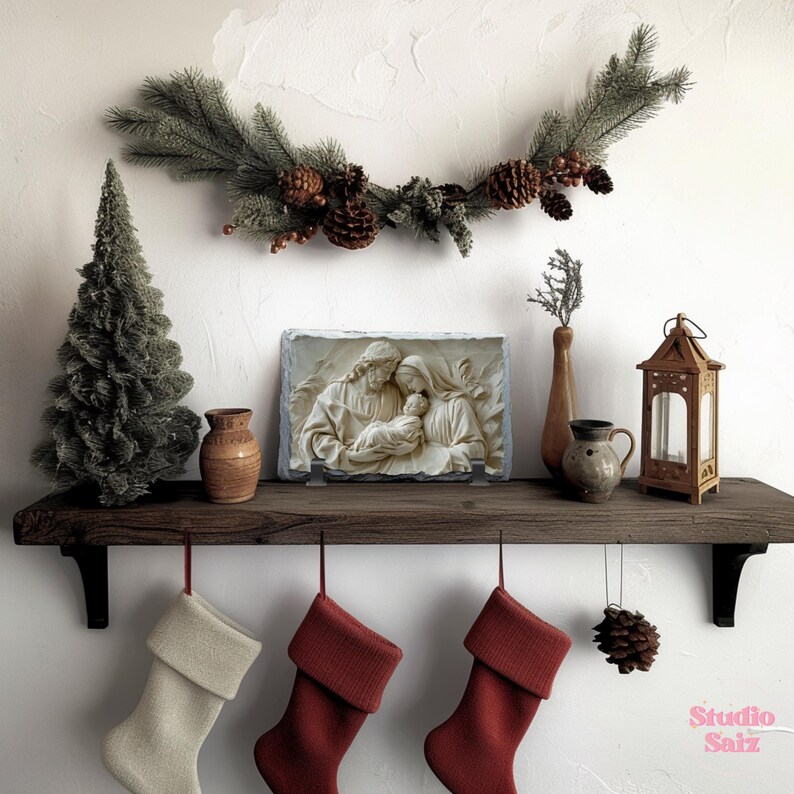 May include: A white stone plaque featuring a relief sculpture of the Holy Family. The sculpture depicts Mary, Joseph, and baby Jesus. The plaque is mounted on a wooden shelf with a Christmas garland above it. There are three stockings hanging from the shelf, two red and one white.