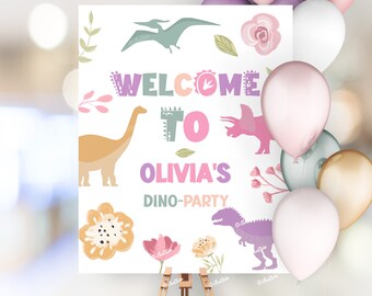 May include: Welcome to Olivia's Dino-Party sign with a pink, purple, and green dinosaur illustration. The sign is on an easel with balloons in the background.