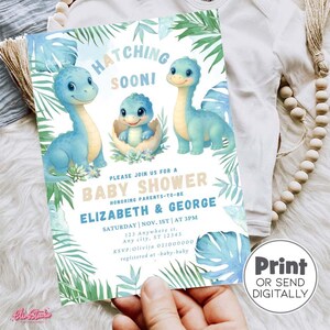 May include: Baby shower invitation with cartoon dinosaurs in blue hues. The card reads "Hatching Soon!" and provides details for Elizabeth & George's baby shower. Includes a "Print or Send Digitally" option.