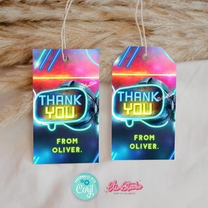May include: Two neon blue and yellow thank you tags with a futuristic gamer theme. The tags have a neon blue and yellow design with the words "Thank You" and "From Oliver."