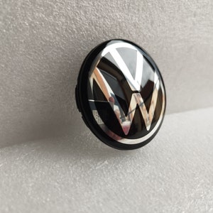 4 enjoliveurs d'origine VW pour Polo ou Golf en 15 pouces - Fixation par 7  clips