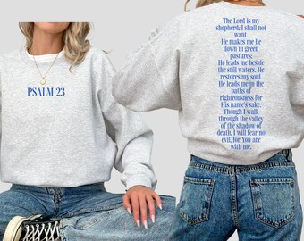 May include: A grey sweatshirt with the text "PSALM 23" on the front and a blue text quote from Psalm 23 on the back.