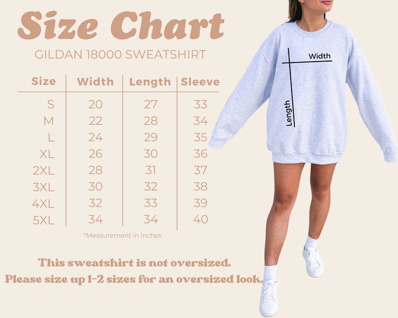 May include: Size chart for a Gildan 18000 sweatshirt, showing measurements in inches for width, length, and sleeve length for sizes S through 5XL. The chart states that the sweatshirt is not oversized and recommends sizing up 1-2 sizes for an oversized look.