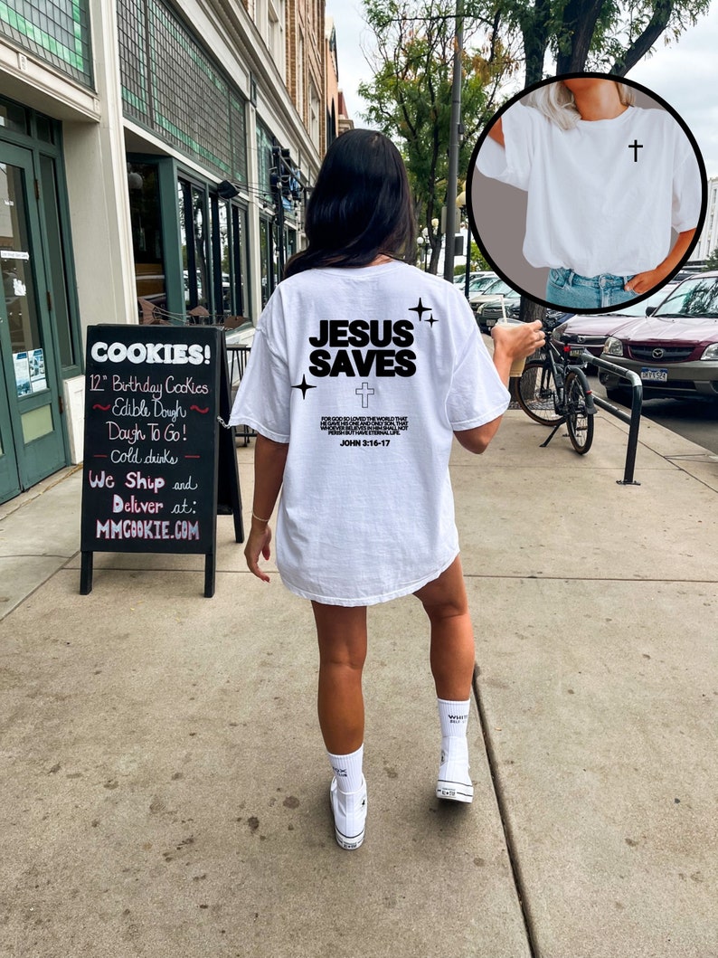 May include: White t-shirt with the text "JESUS SAVES" and a cross graphic. The text "JOHN 3:16-17" is also included on the shirt.