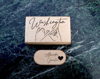 May include: Wooden USB flash drive and case. The case is rectangular with the word "Washington" and a pinky promise design. The USB drive is oval with the names "Alexander Jennifer" and a heart symbol.