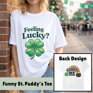 May include: White t-shirt with the text "Feeling Lucky?" and a green four-leaf clover design. The back design shows a rainbow, a pot of gold, and the words "Carry Me". A "Funny St. Paddy's Tee" is displayed.