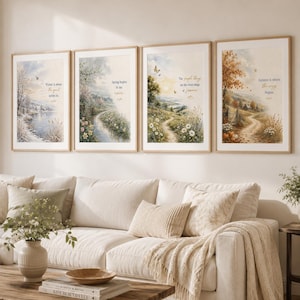 May include: Four framed wall art prints depicting the four seasons in a watercolor style. Each print features a landscape scene with text: Winter is where the quiet settles in, Spring begins in the rain, The simple things are the sweet things of summer, and Autumn is where the cozy begins.