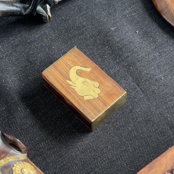 Hand-carved rosewood box with intricate brass elephant inlay — the kind of artisan keepsake that looks way more expensive than $12.