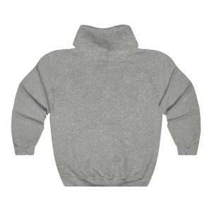 May include: A gray hooded sweatshirt with a mock neck.
