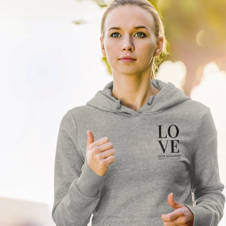 May include: Gray hooded sweatshirt with the text "LOVE YOUR NEIGHBOR" printed on the front.
