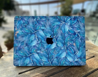 Pattern of blue leaves on the background | Leaves with accents of golden spots | Layered leaves in different shades of blue