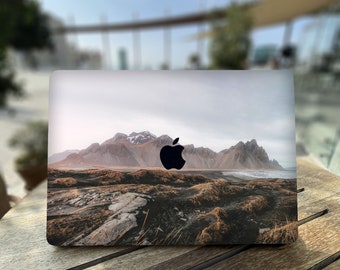 Mountains with pointed peaks | Mist enveloping the mountain base | Contrast of gray rocks and brownish vegetation for MacBook Air 13 15 M3