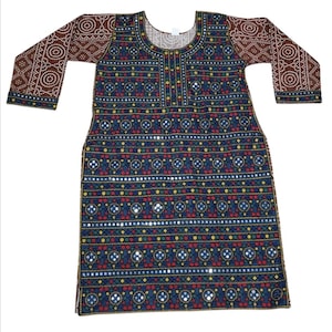 May include: A long-sleeved, navy blue tunic with intricate patterns and mirror embellishments. The body of the tunic features rows of geometric designs in red, yellow, and green. The sleeves are brown with a white dot pattern.