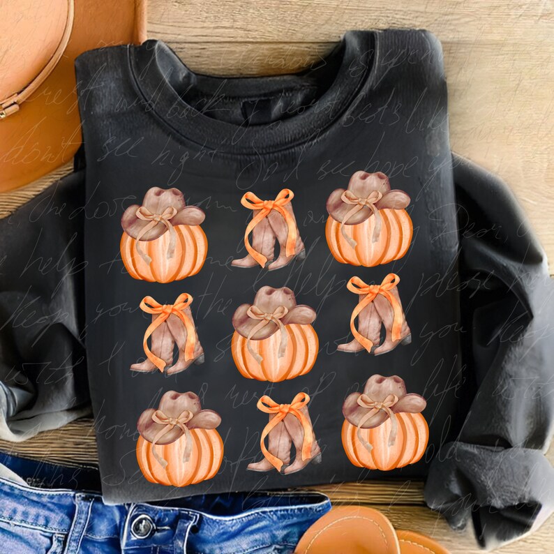 May include: A black sweatshirt with a repeating pattern of orange pumpkins with brown cowboy hats and brown boots with a brown bow.