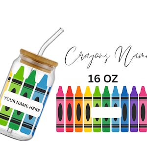 May include: A clear glass jar with a bamboo lid and a straw, decorated with colorful crayon illustrations. The jar has a label that says "Your Name Here". The jar is 16 ounces and is part of a set of personalized crayon-themed drinkware.
