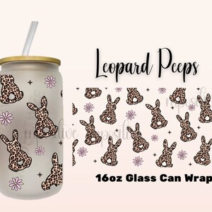 May include: A 16oz glass can wrap with a leopard print bunny pattern. The wrap features pink flowers and black stars on a white background. The text "Leopard Peeps" and "16oz Glass Can Wrap" is printed on the wrap.