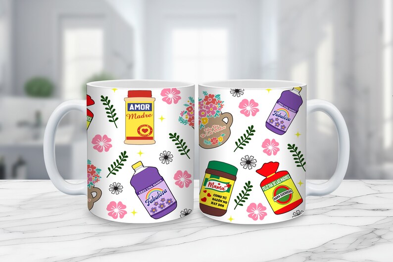 May include: Two white ceramic mugs with a floral pattern and various colorful illustrations of household products, including a jar of salsa, a bottle of cleaning solution, and a box of crackers. The text on the products includes "Amor Madre", "Fabulosa", "Mama", and "Dulce de Leche"