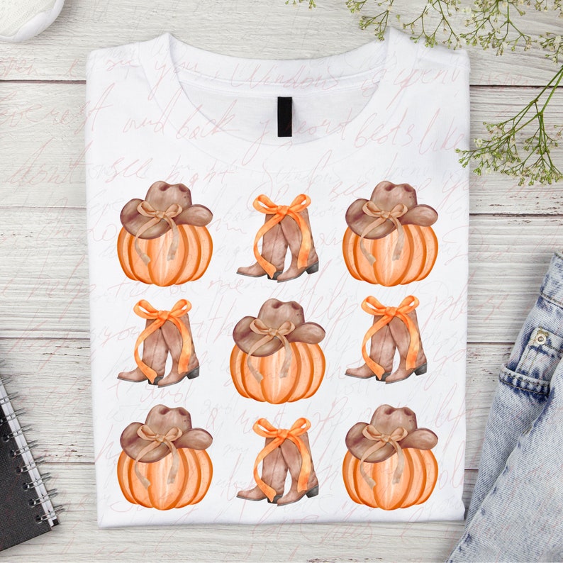 May include: A white t-shirt with a repeating pattern of orange pumpkins with brown cowboy hats and brown cowboy boots with a bow.