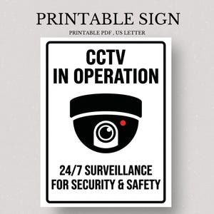 May include: A black and white printable sign with the text "CCTV IN OPERATION" and "24/7 SURVEILLANCE FOR SECURITY & SAFETY". The sign also features a graphic of a security camera.