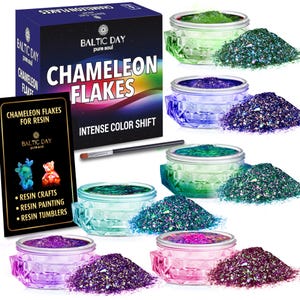 May include: Six small jars of iridescent chameleon flakes for resin crafts. Each jar contains a different color of flakes, including green, blue, teal, and pink. The jars are labeled "Chameleon Flakes for Resin" and "Intense Color Shift".